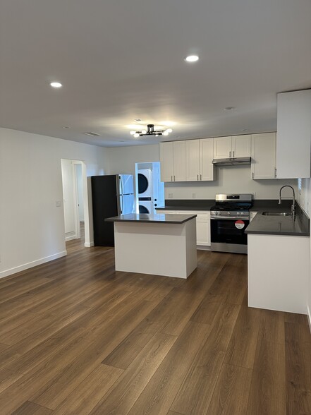 Kitchen with all new appliances. Washer and dryer in the laundry room - 4016 Prospect Ave