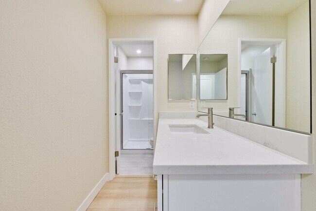 Building Photo - Refreshed 2/2 Second Floor Campbell Condominium in Great Location! Attached Garage & Additional S...