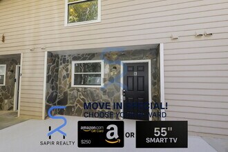 Building Photo - Move in before January 15th and choose your reward: a $250 Amazon Gift Card or a 55" Smart TV!