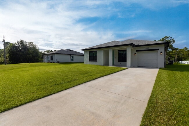 Building Photo - Brand New 4-Bedroom Gem with 2 Full Baths on Large Lot in Lehigh Acres – A Perfect Family Haven!