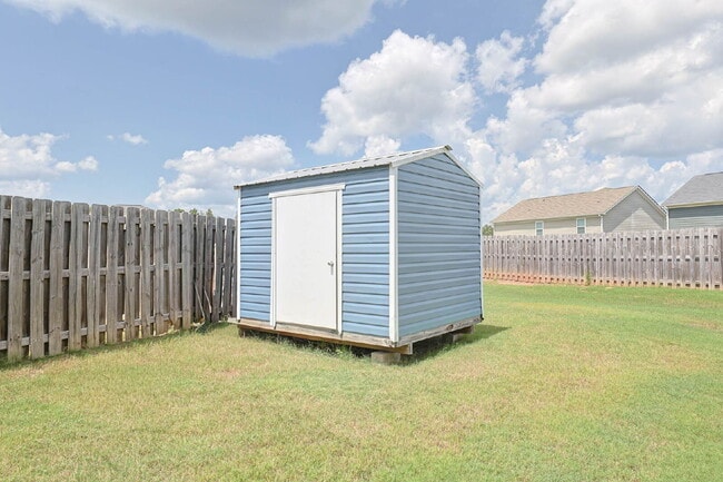 Building Photo - 4BR/3.5BA · 2,809 SF · Owner's Suite on Main · Fenced Yard · Midland, GA — $2,800/mo