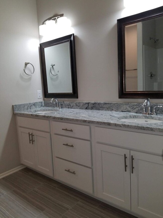 Building Photo - Daylight ranch townhome with 2 stall garage.  Private driveway and covered deck. high end finishe...