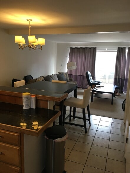 View of dining area and living room from front entrance, kitchen on left - 3000 Colorado Ave