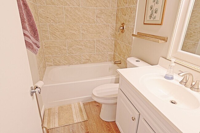 Building Photo - Spacious 3-Bedroom Attached Villa with Finished Basement & Private Fenced Yard!