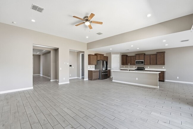 Building Photo - Spacious 5-Bedroom Home with Open Floor Plan & Private Backyard