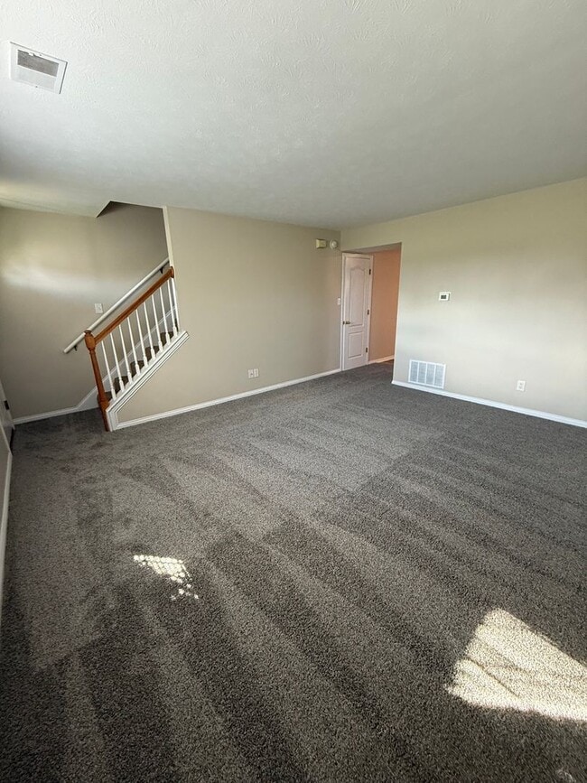 Building Photo - 2-bedroom, 1.5-bath townhouse with an attached garage