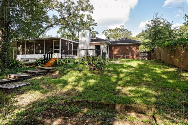 Building Photo - 3/2 Brick Home with Sunroom, Deck, and Car...