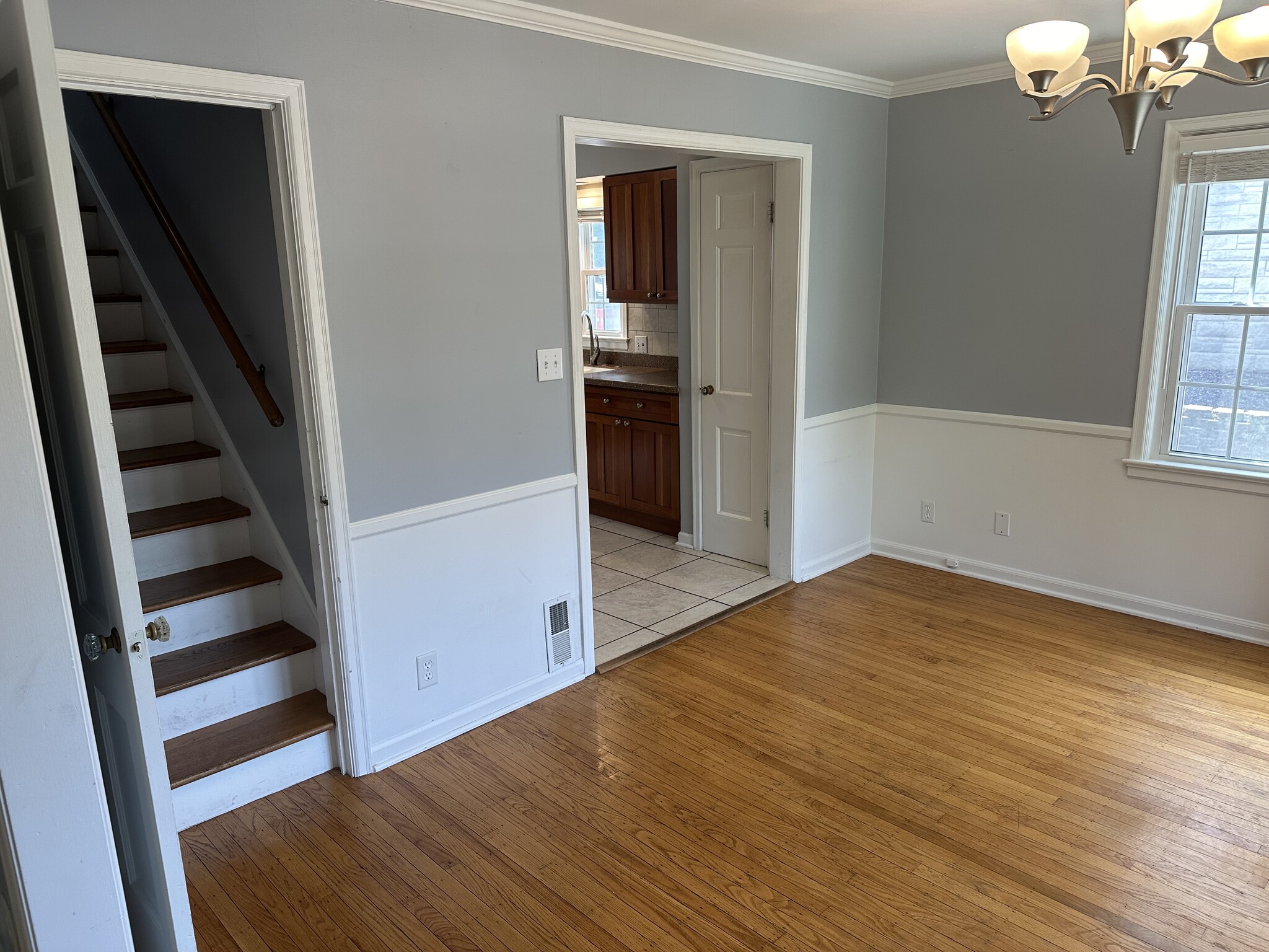 Kitchen and door to upstairs off the dining room. - 5101 Boulevard Pl