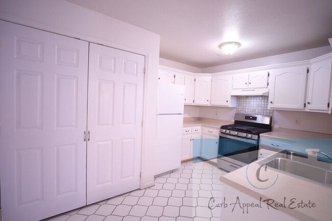 Building Photo - First month move in special $900!! Beautiful 3-bed, 2 bath condo with 2-car garage - includes was...