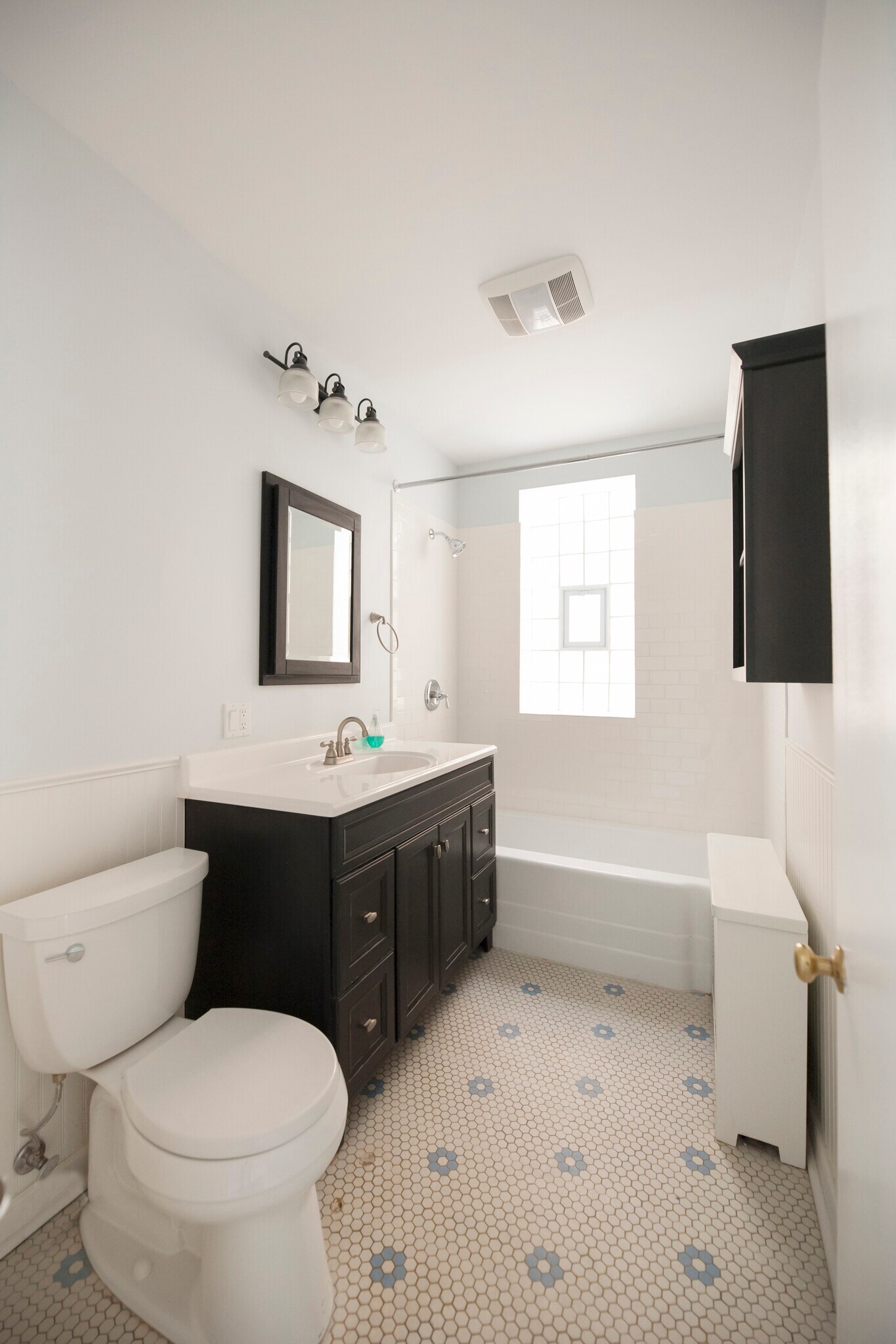 Updated bathroom with original floor - 2250 W Addison St