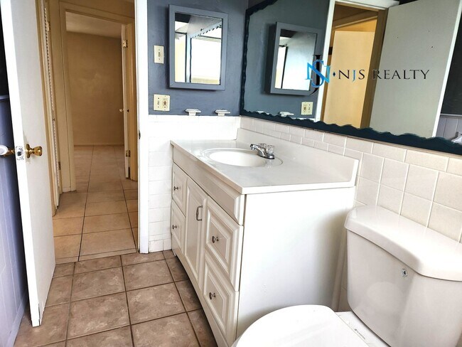 Building Photo - True 2/1.5/1 with FIREPLACE, fenced yard and all tile flooring throughout!