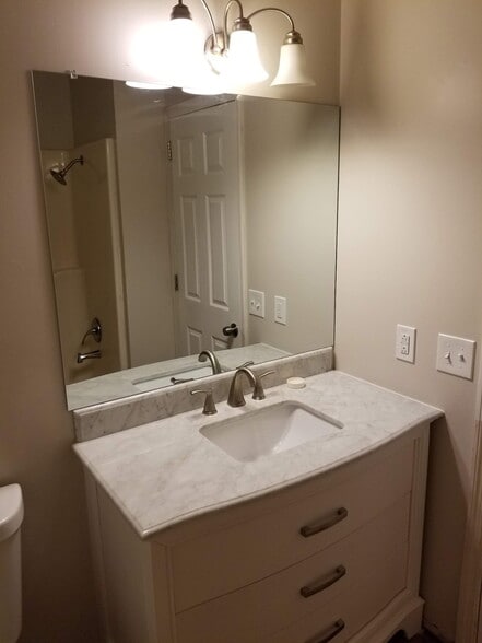 New bathroom cabinet with quartz counter top and new paint - 111 Cash Ln