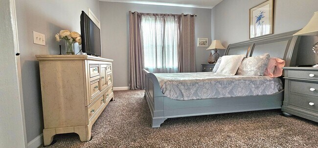 Building Photo - Stunning First-Floor, Fully Furnished Condo with Pond Views