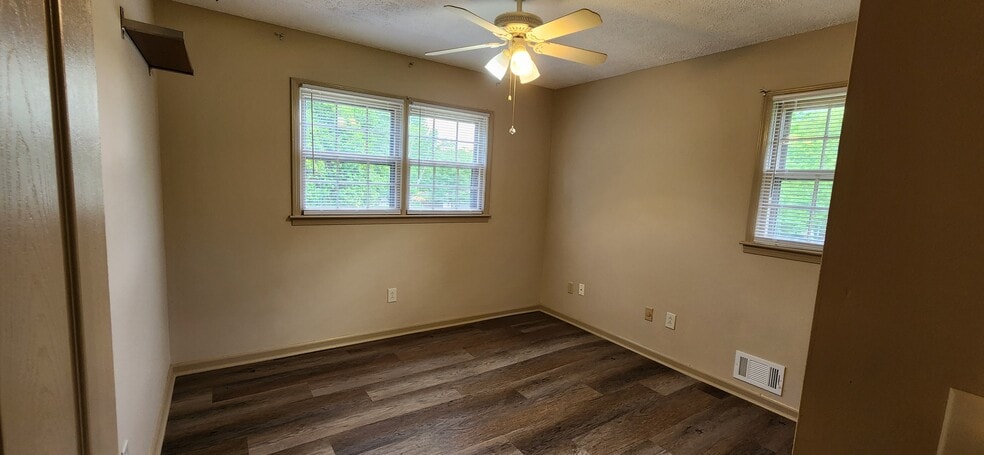 Second bedroom with double-door closet. Third bedroom is similar. - 5787 Lorraine Dr