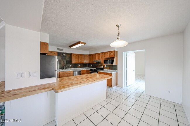 Building Photo - 3408 W Port Au Prince Ln