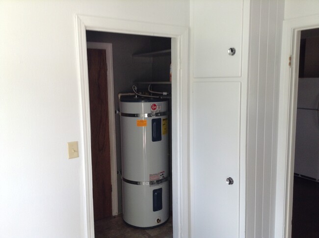 A newer hot water tank than the picture is installed as well as a whole house water filtration system and reverse osmosis for drinking water. Broom closet storage just off the Laundry Room right next to the Kitchen. - 24 N K St