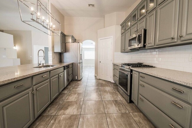 Building Photo - STUNNING 3 Bedroom Home with a 3 CAR GARAGE & RV PARKING!