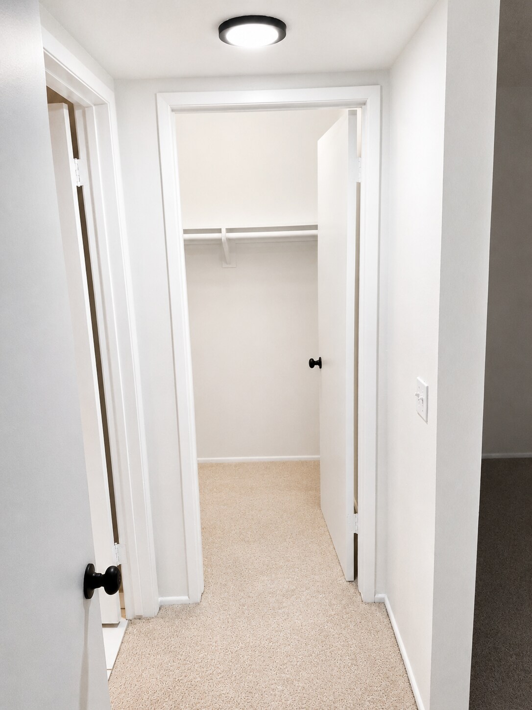 Bedroom closet with built-in shelving and hanging space for convenient storage. - 339 E Taft Ave
