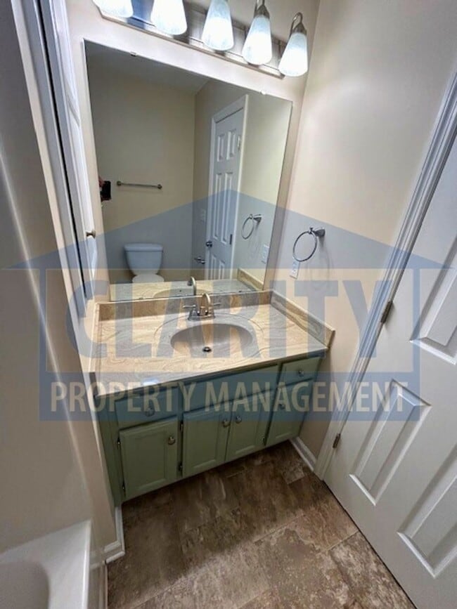 Building Photo - Three bedroom with attached garage!