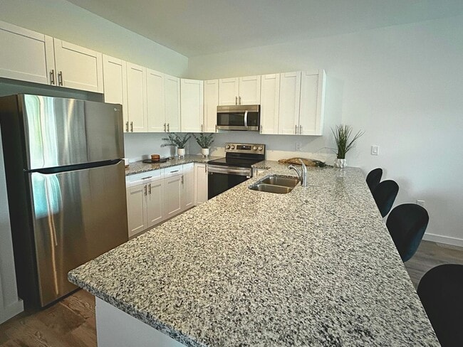 Building Photo - Modern Living Redefined: Luxury Duplexes i...