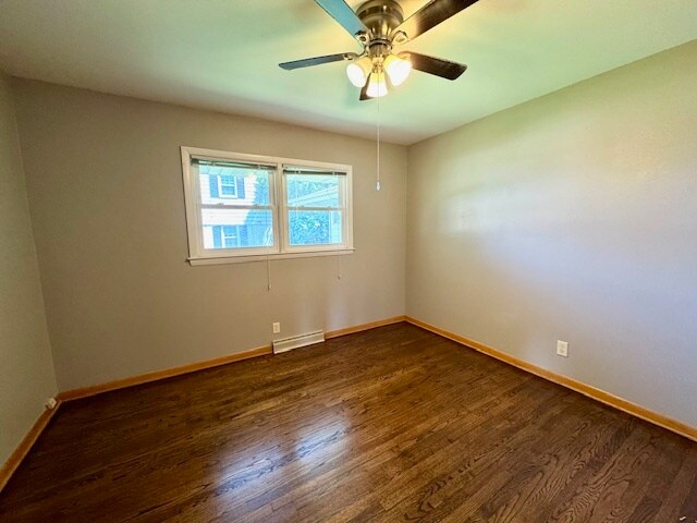 Bedroom with hardwood floors - 2670 N 116th St