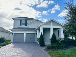 Building Photo - "Unfurnished" Luxurious 5/3.5 Stunning Home with a Generous Loft and a 2 Car Garage in the Highly...