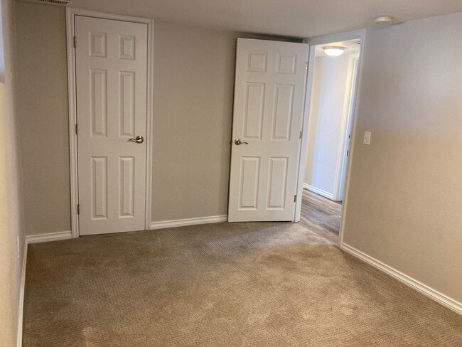 Building Photo - Spacious 4-Bedroom, 2-Bath Home with Daylight Basement, Large Yard & Two Fireplaces!.