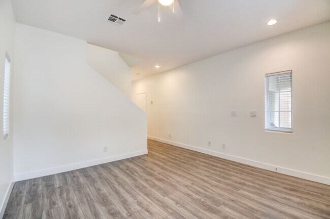 Building Photo - Great home with 4 bedrooms, 2.5 baths. New Floors Paint and Countertops.