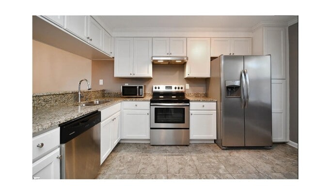 Building Photo - Charming 2-bedroom, 2.5-bathroom townhouse...