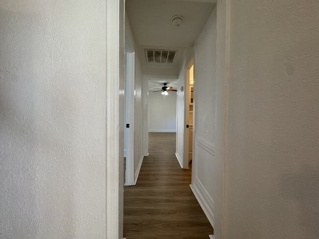 Hallway from bedroom 1 to other bedrooms and living room - 2600 18th Ave S