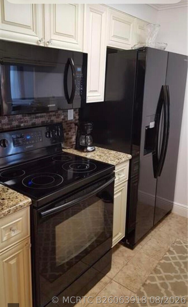 Building Photo - 9466 Boca Cove Cir