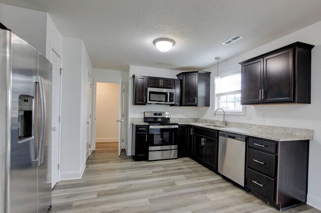 Building Photo - Fresh and so Clean Clean Close to Everything!