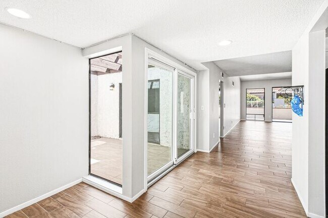 Building Photo - Gated 3-Bedroom Townhome with Fireplace, Patio & 2-Car Garage