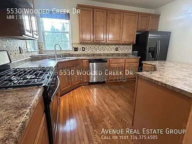 Building Photo - 5530 Wooded Creek Dr