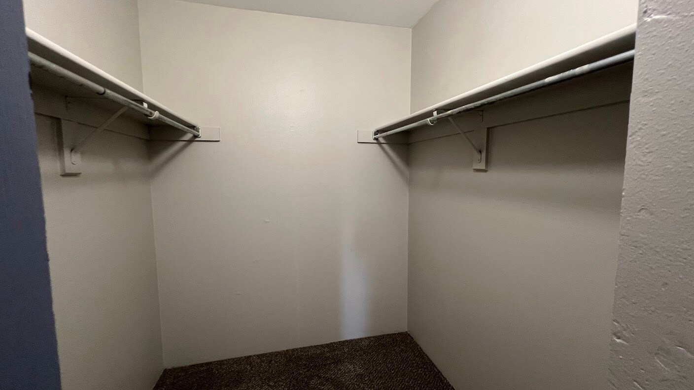 Spacious walk-in closet in Bedroom 1. - 12063 E Harvard Ave