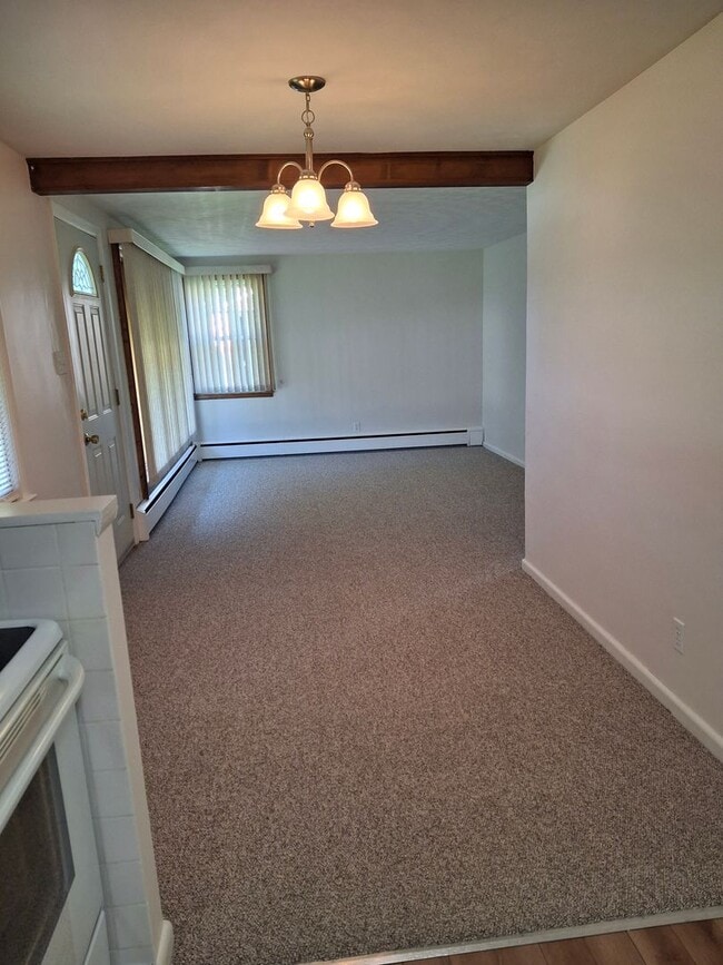 Building Photo - Charming 3-Bedroom Home with Backyard & Of...