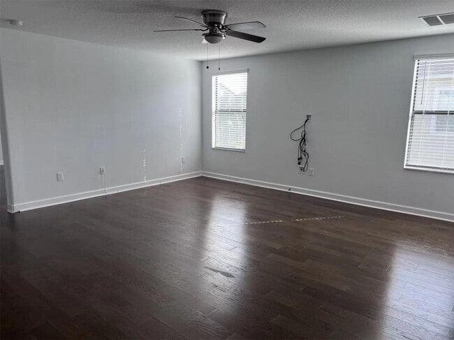 Building Photo - "Spacious 5-Bed Retreat with Elegant Hardw...