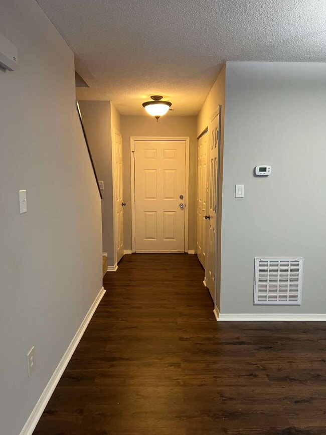 Building Photo - Charming 3 bedroom 2 bath townhome with lots of light and open downstairs. Galley kitchen, lots o...