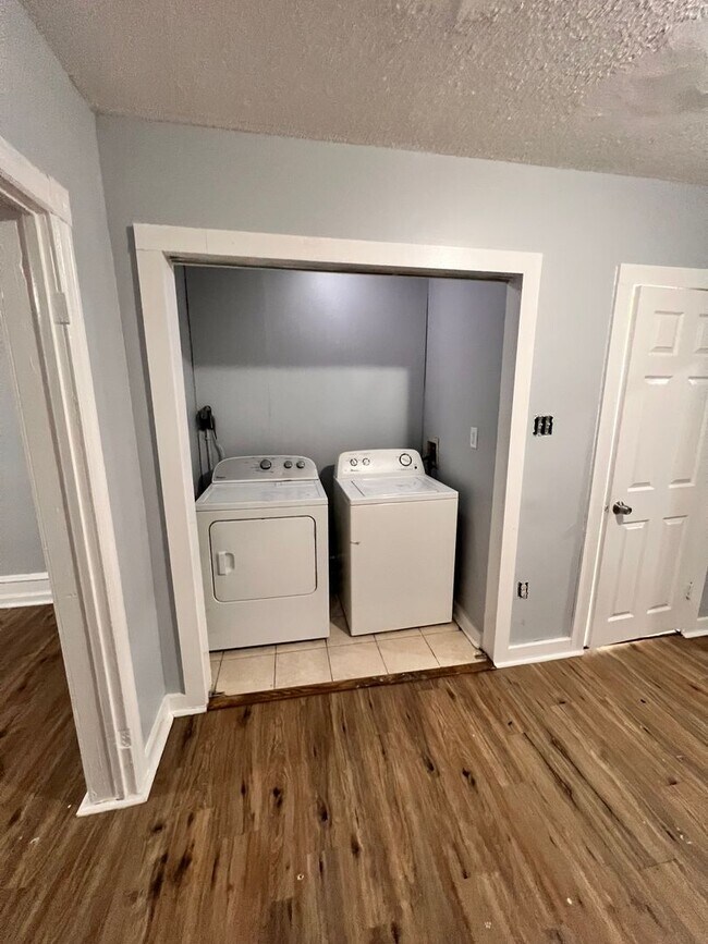 Building Photo - Updated 3 Bedroom 1.5 Bath Townhome w/ Paved Yard + Washer & Dryer