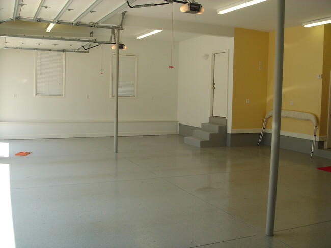 Secured attached garage. Completely finished and has epoxy floor finish. - 5040 Postlewaite Rd