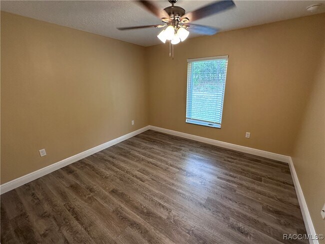 Building Photo - 7779 N Triana Dr