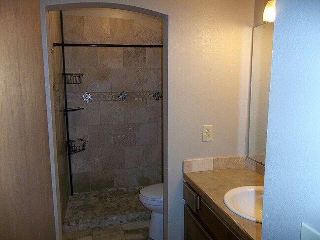 Building Photo - $500 OFF First Month | Charming 2BR Townhome with Garage