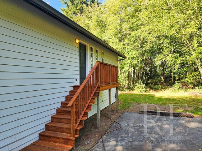 Building Photo - Vaulted Ceilings, Unique Designer Kitchen & Expansive Half-Acre Setting with Flexible Living Spaces