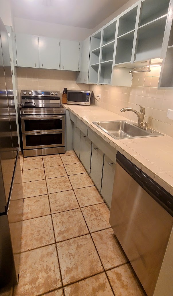 Kitchen with ss appliances. - 3 Island Ave