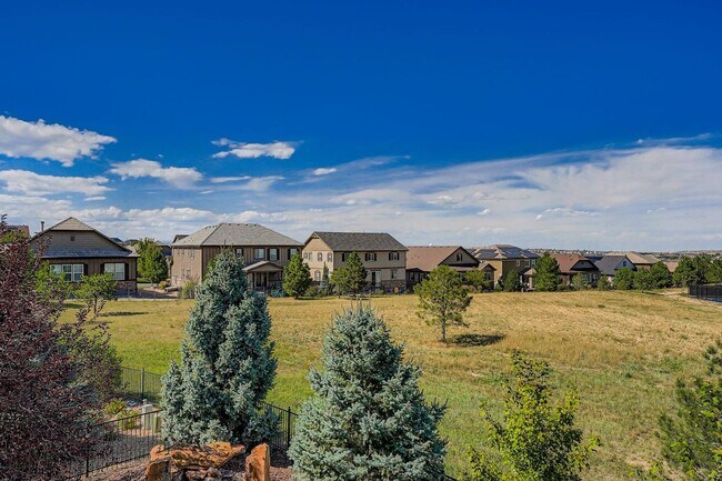 Building Photo - Beautifully maintained 5-bedroom home with a large finished basement, club access, and top-rated ...