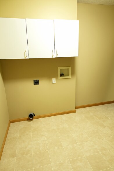 Separate full laundry room - 13040 Europa Trail Way N