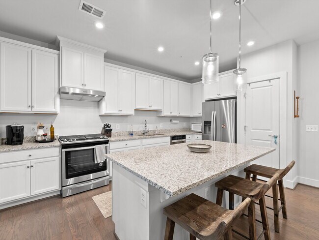 Building Photo - Discover Modern Comfort at Wind Charm Street