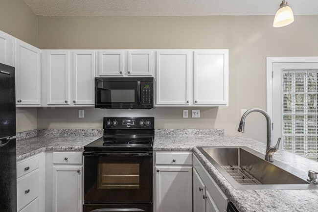 Building Photo - Like New Home off Freeman Mill.  Just Painted, New Wood/Vinyl Flooring, Vaulted Ceilings, Front P...