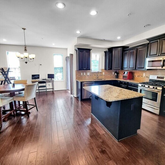 Building Photo - Stately End Unit 3-Level Townhome, 3 Bedro...