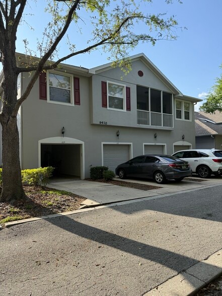 View of rear of building + garage - 9410 Georgian Park Ln